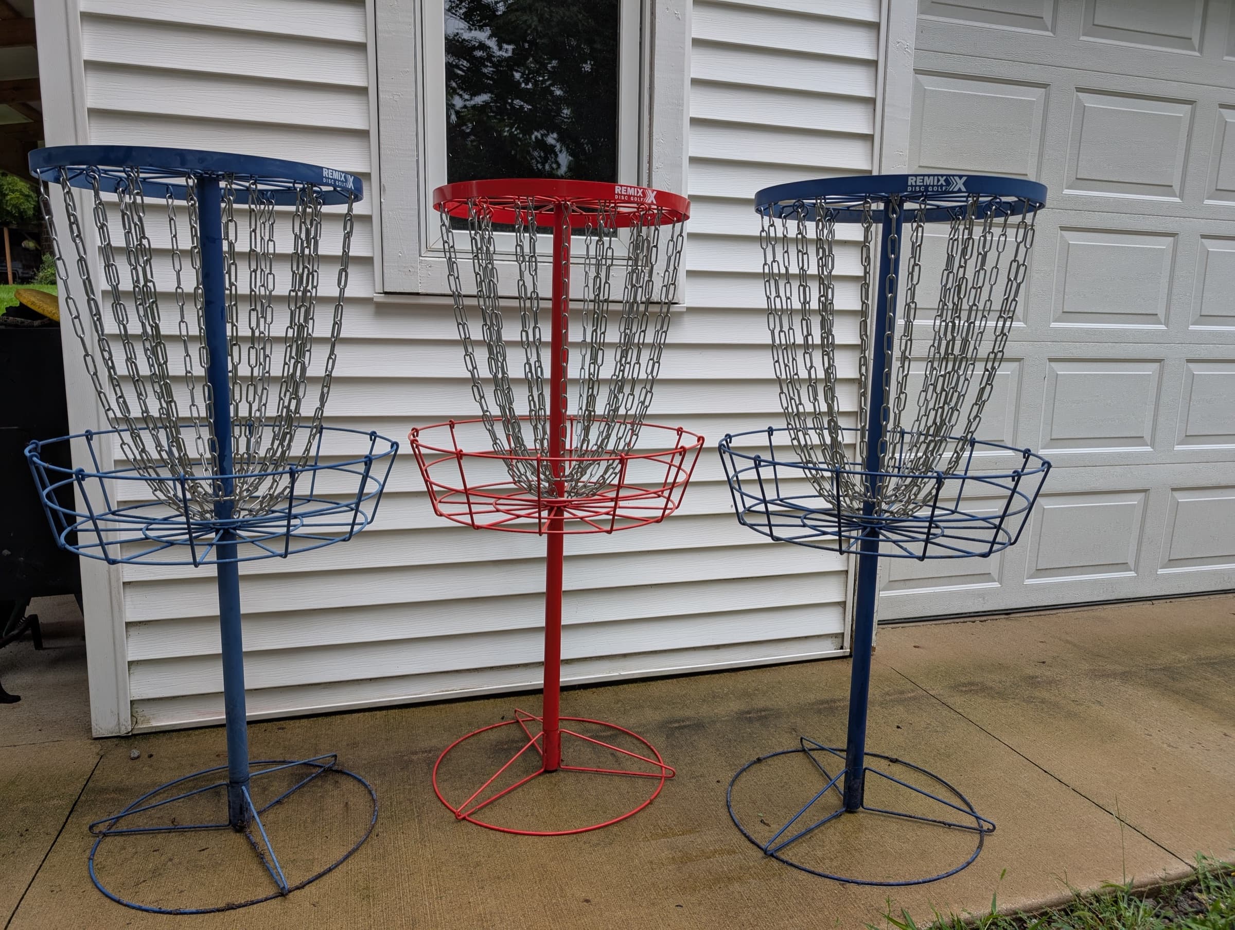 Three disc golf baskets ready to rent